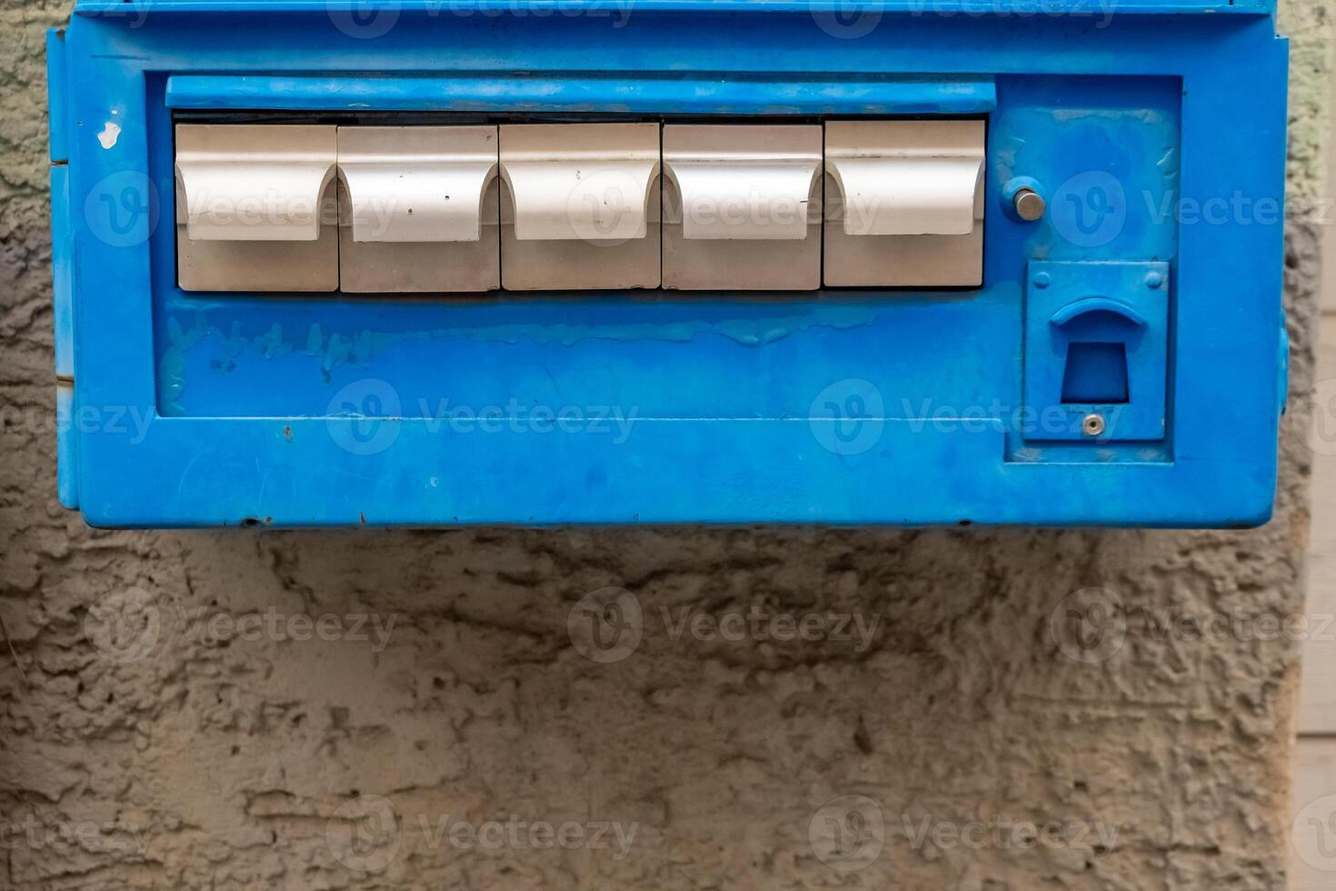 an old blue cigarette machine photo