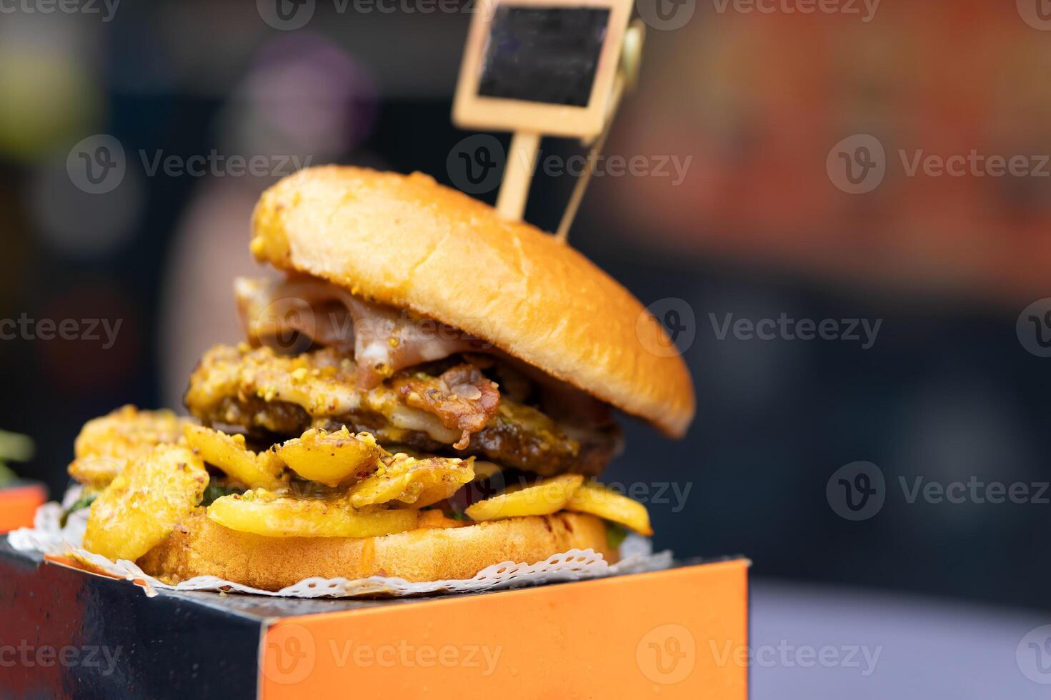 big delicious hamburger on sale on the street photo