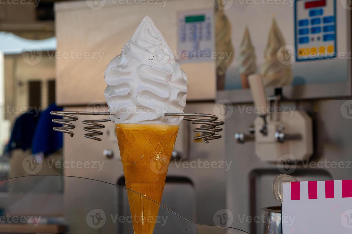 ice cream machine with decorative ice cream in the foreground photo