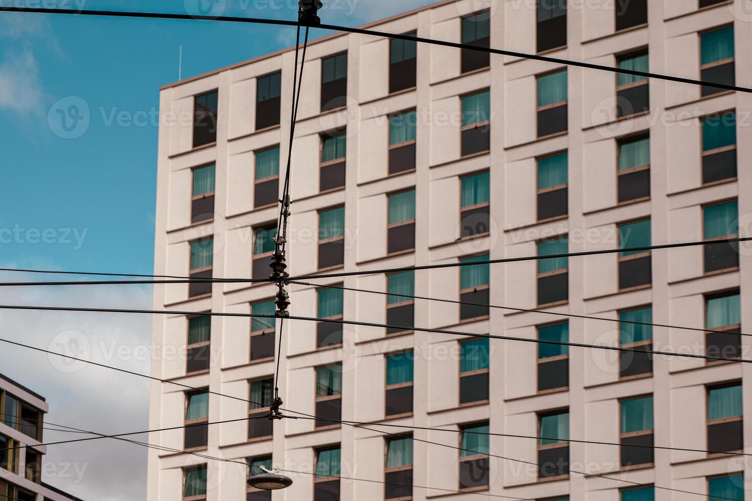 power lines in front of a modern building photo