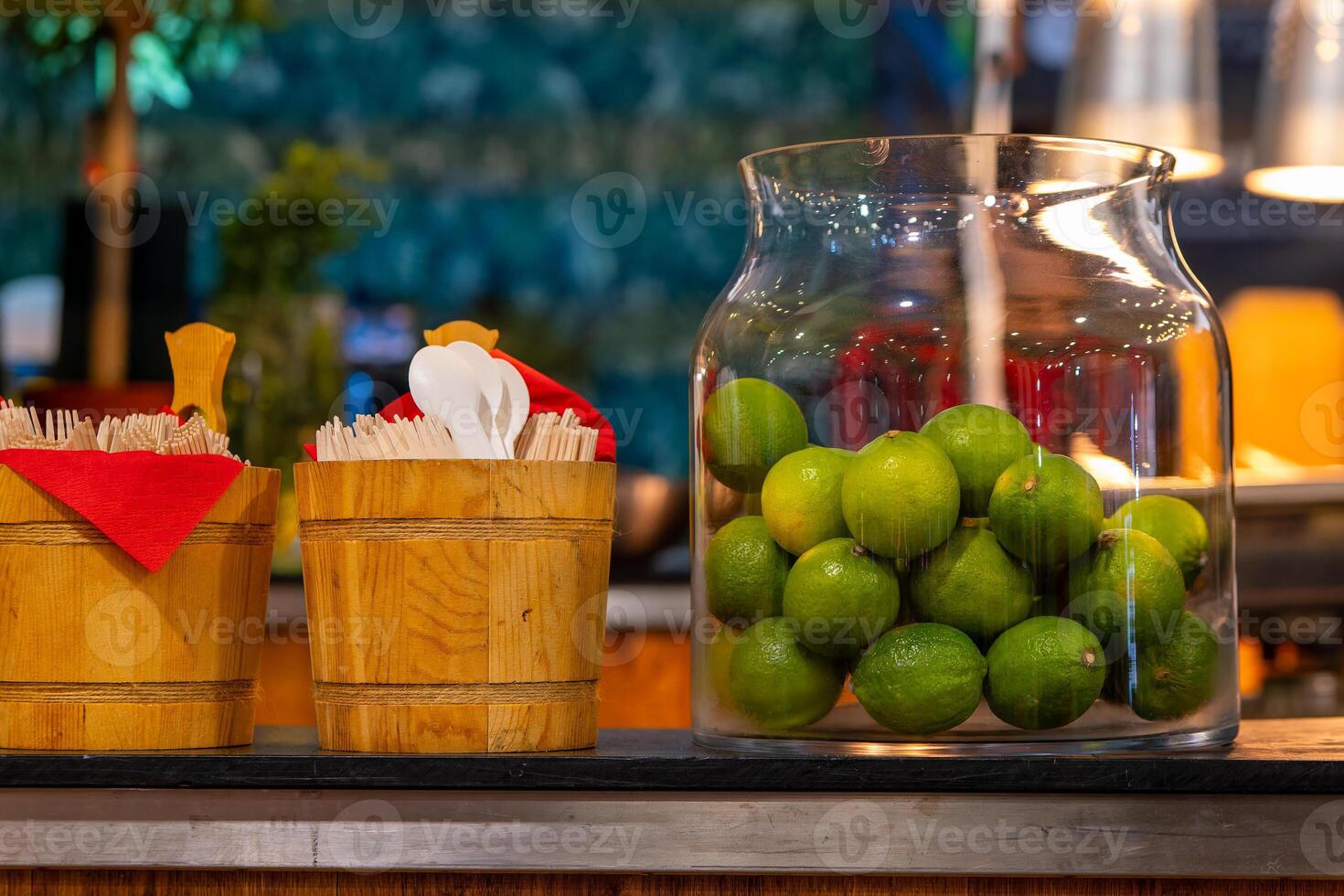 fresh limes in a glass at a bar photo