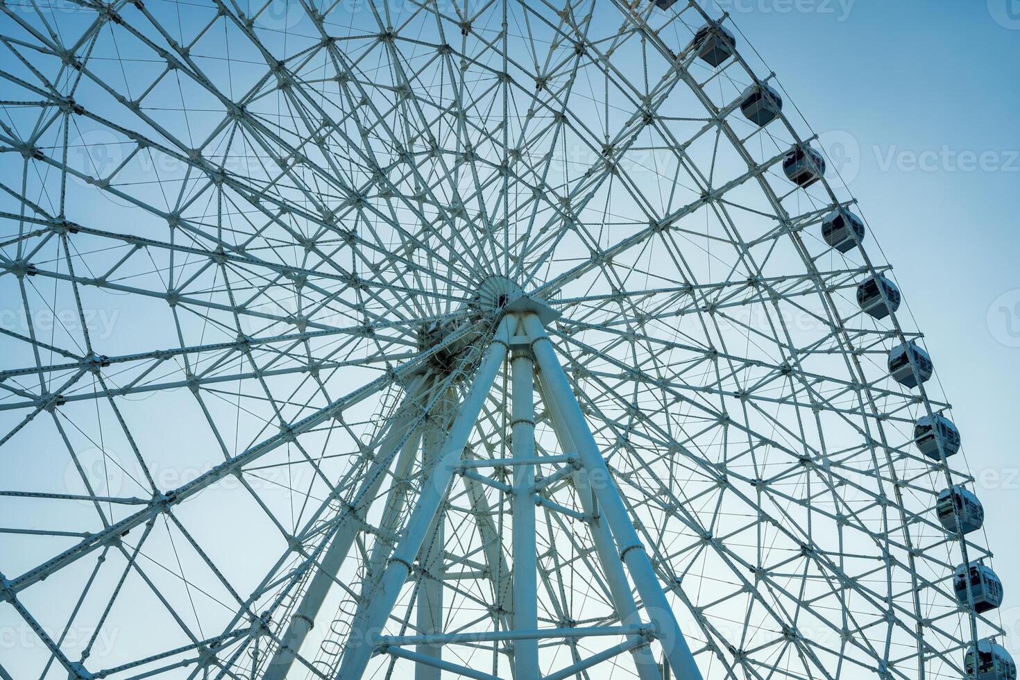 Ferris wheel at sunset or sunrise in an amusement park. photo