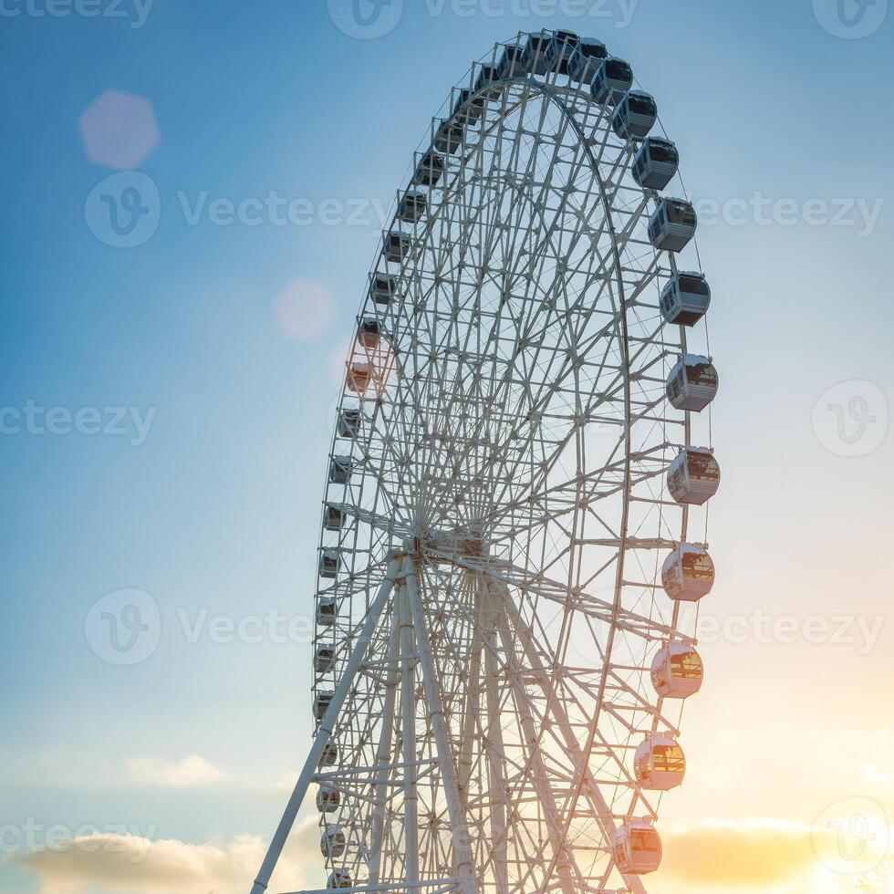 Ferris wheel at sunset or sunrise in an amusement park. photo