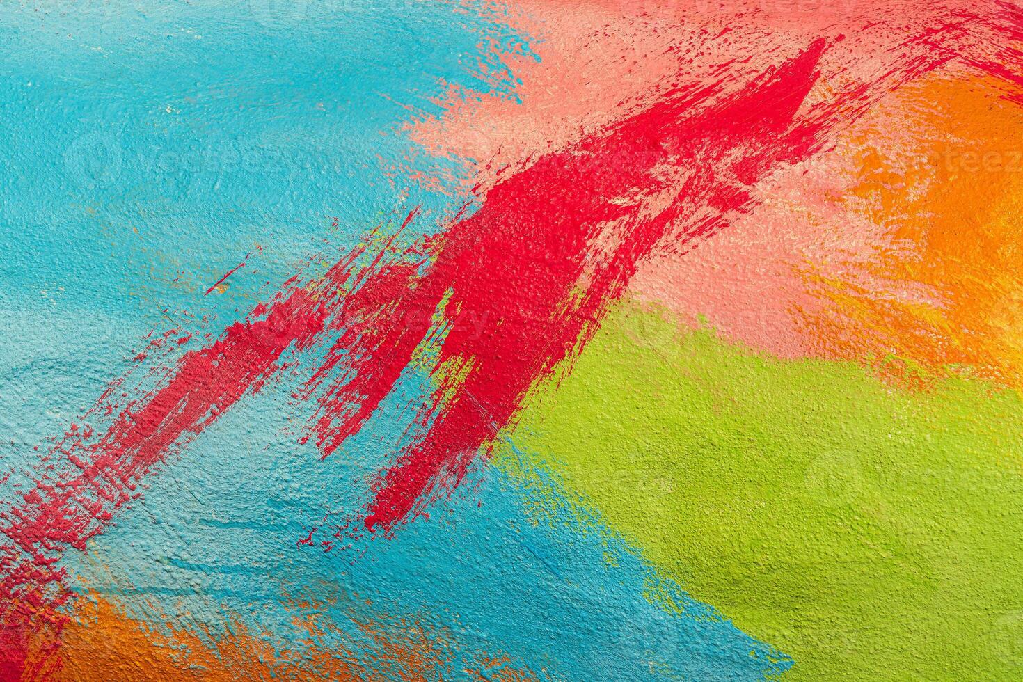 A fragment of colorful graffiti painted on a wall. Abstract urban background. Spray painting art. photo