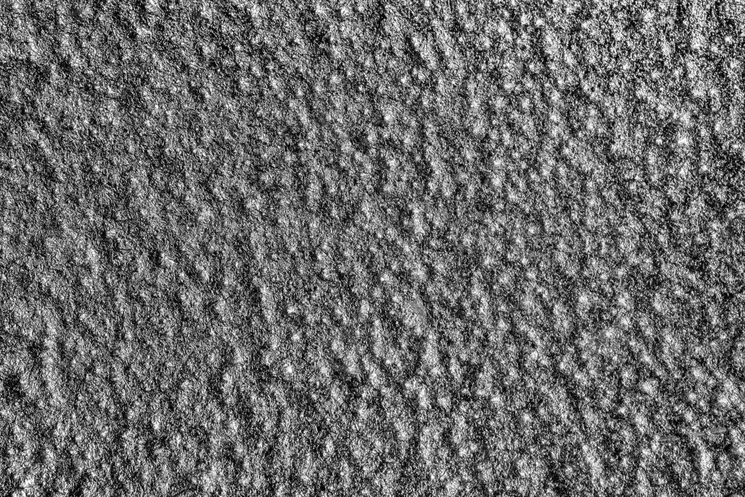 Monochrome texture of shiny grained metal. Abstract background. photo