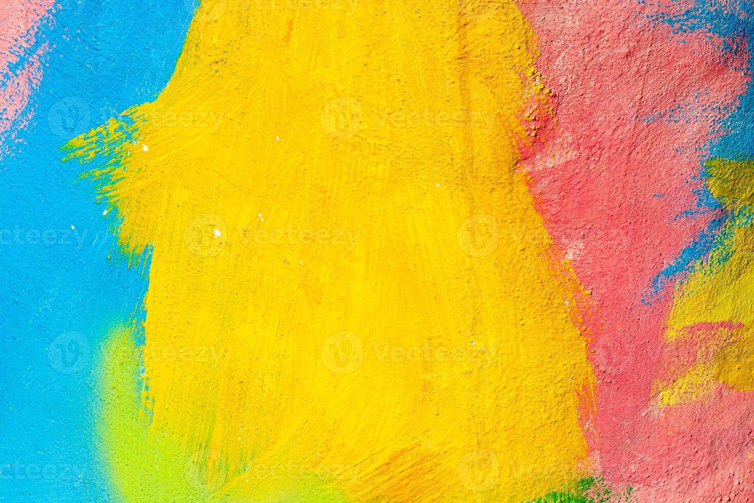 A fragment of colorful graffiti painted on a wall. Abstract urban background. Spray painting art. photo