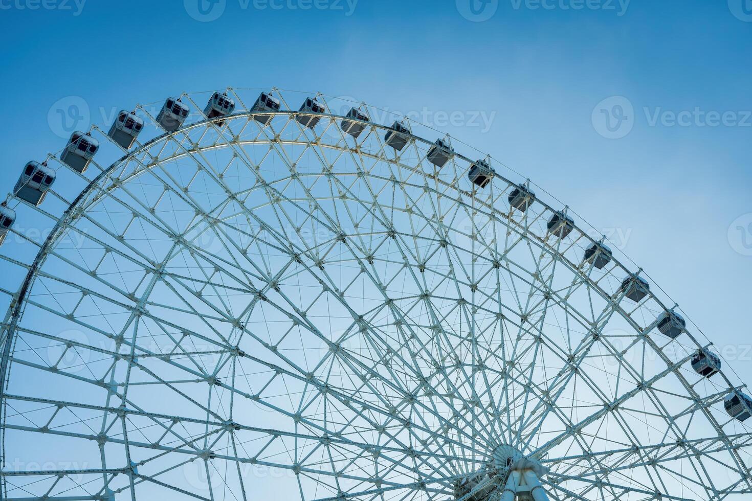 Ferris wheel at sunset or sunrise in an amusement park. photo