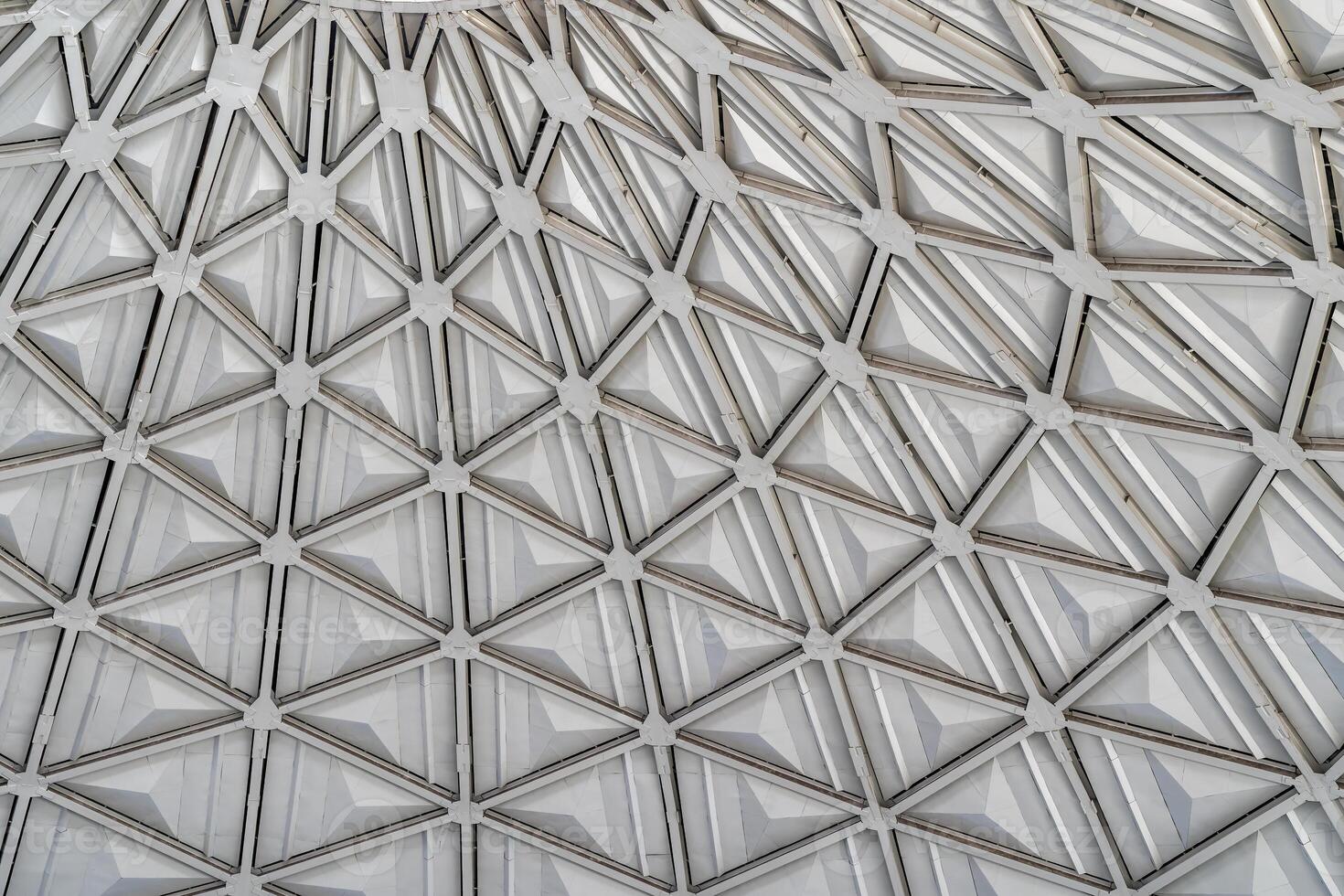 The steel inner part of the roof with the framework of the Chorsu Bazaar in Tashkent. Geometric architectural background. photo