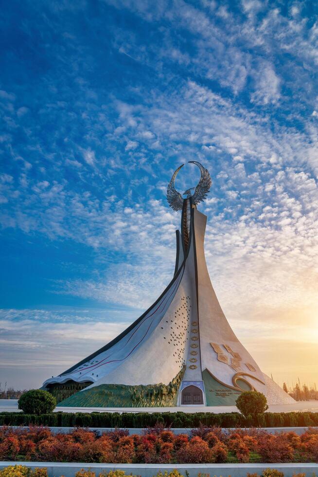 UZBEKISTAN, TASHKENT - JANUARY 4, 2023 Monument of Independence in the form of a stele with a Humo bird in the New Uzbekistan park. photo