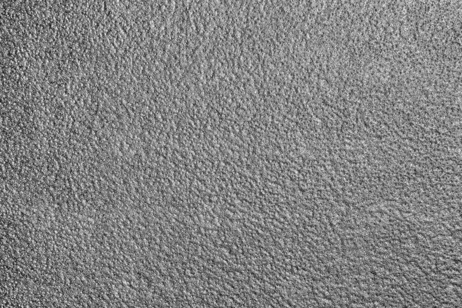 Monochrome texture of shiny grained metal. Abstract background. photo