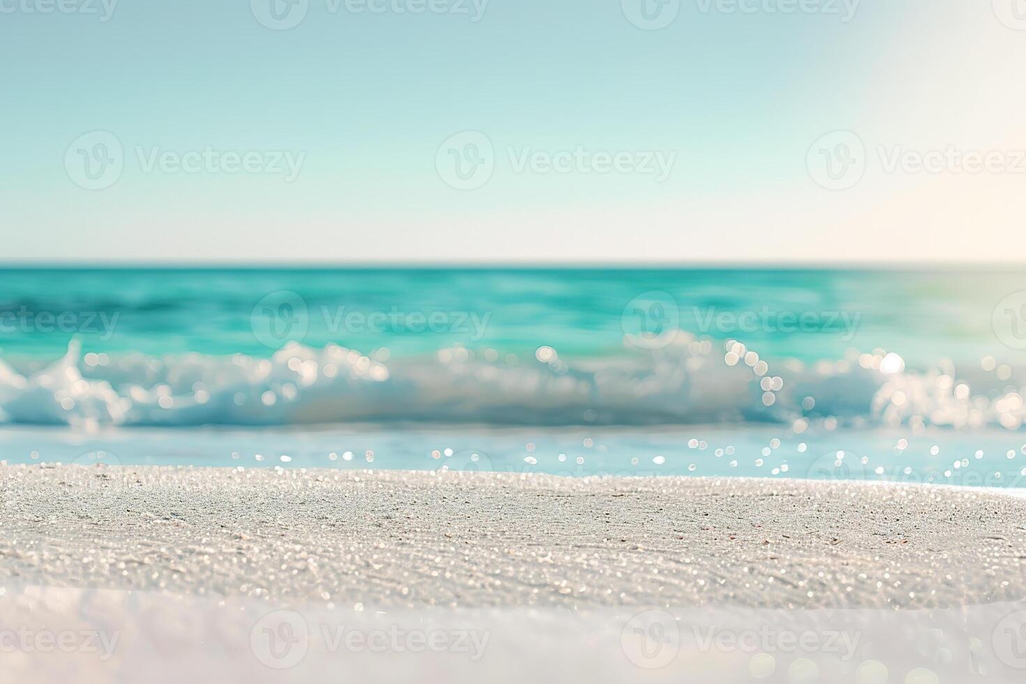 White sand beach and blured turquoise waves and sky on a background. Summertime seascape. photo