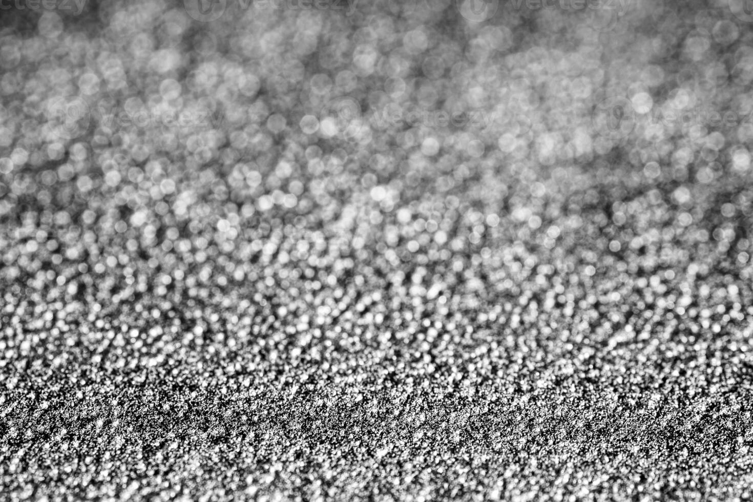 monocromo textura de brillante granulado metal. resumen antecedentes. foto