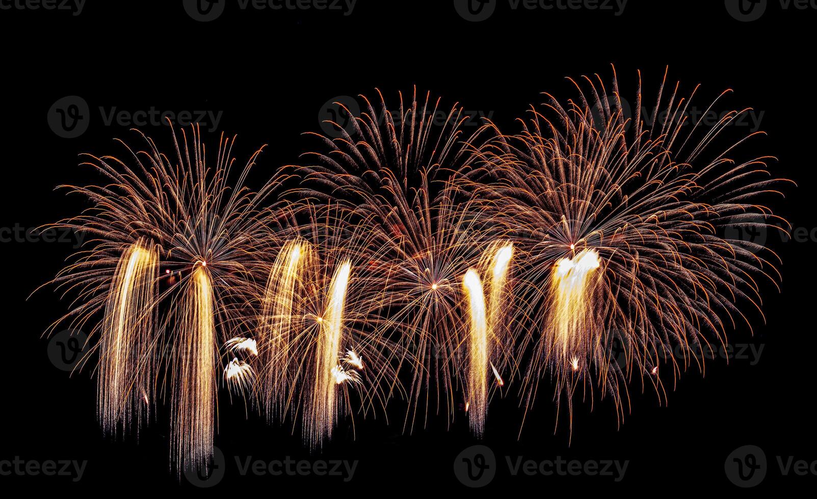 Colorful celebration fireworks isolated on a black sky background. photo