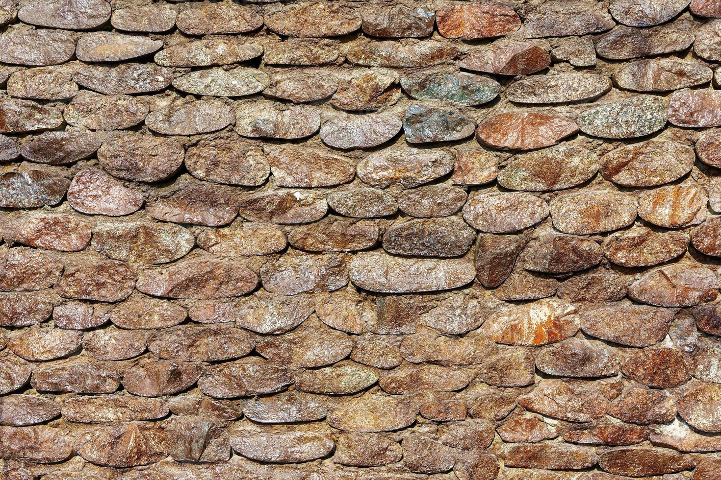 Old antique stone wall texture. Abstract background for design. photo