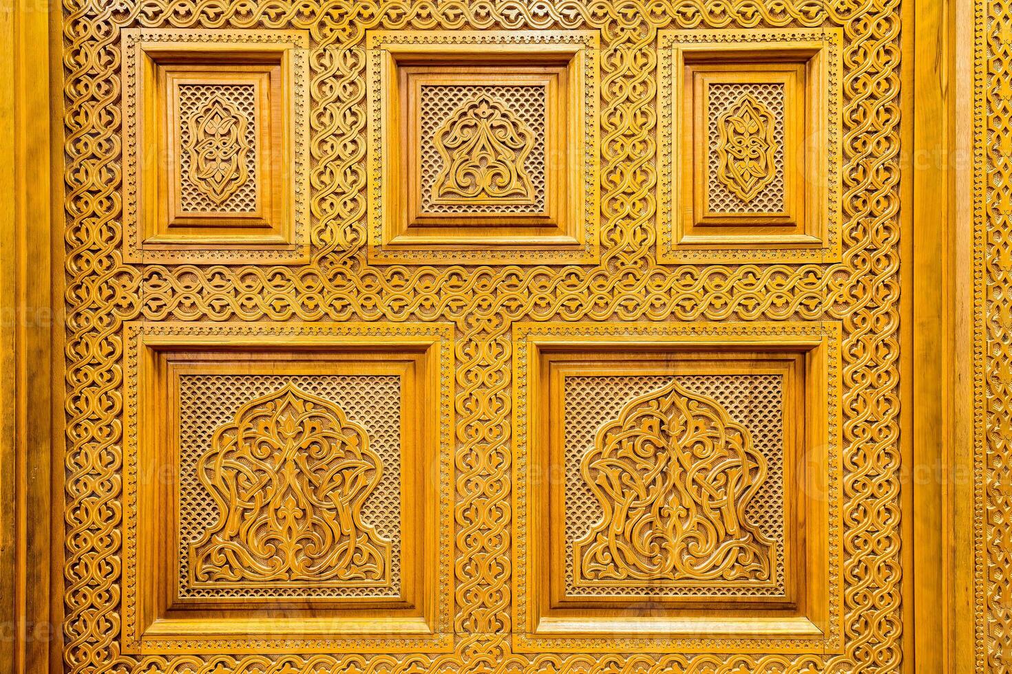 Carved wooden doors with patterns and mosaics. Abstract background. photo