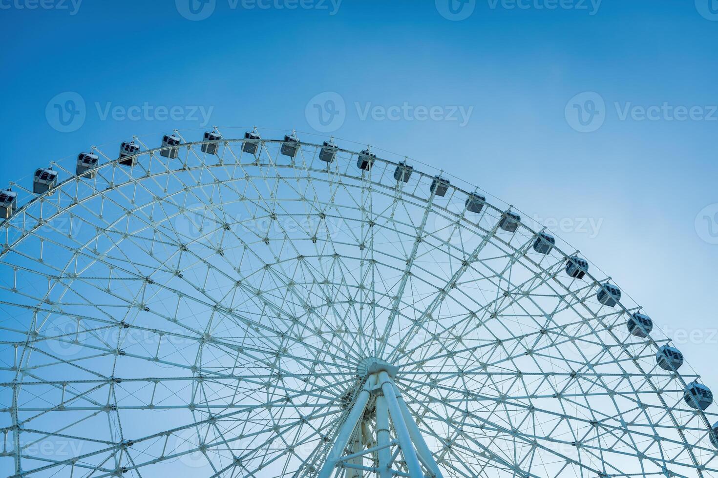 Ferris wheel at sunset or sunrise in an amusement park. photo