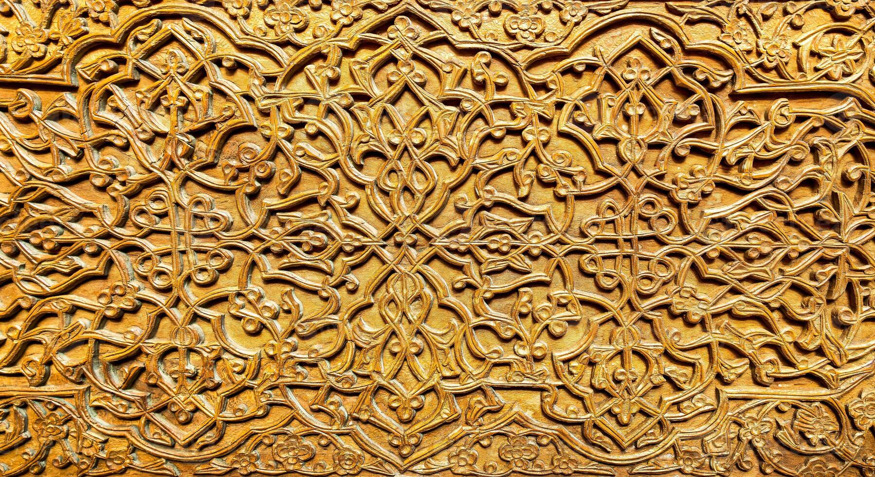 Fragment of an ancient carved wooden door. Ornate. photo