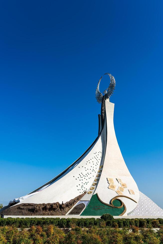 UZBEKISTAN, TASHKENT - SEPTEMBER 15, 2023 Monument of Independence in the form of a stele with a Humo bird on a daytime in the New Uzbekistan park in summer. photo