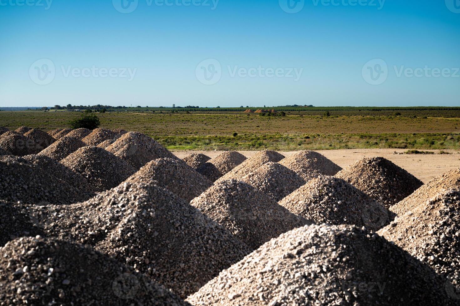 Piles of Gravel in Countryside photo