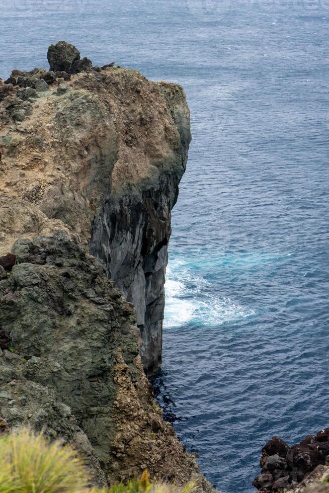 Stunning aerial view of dramatic cliffs overlooking the vast expanse of the Atlantic Ocean on Terceira Island, Azores. photo