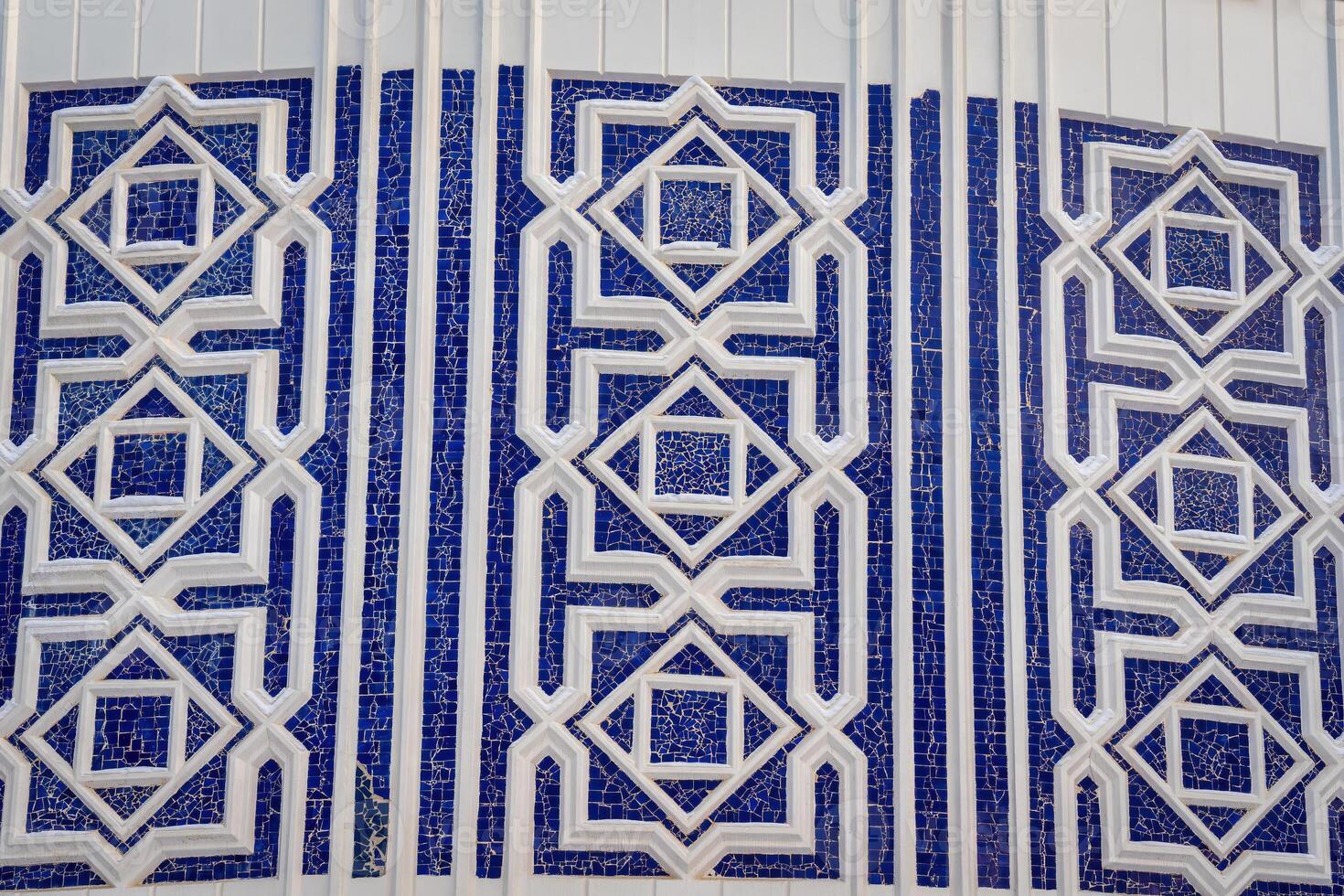 Geometric traditional Islamic ornament. Fragment of a ceramic mosaic. photo