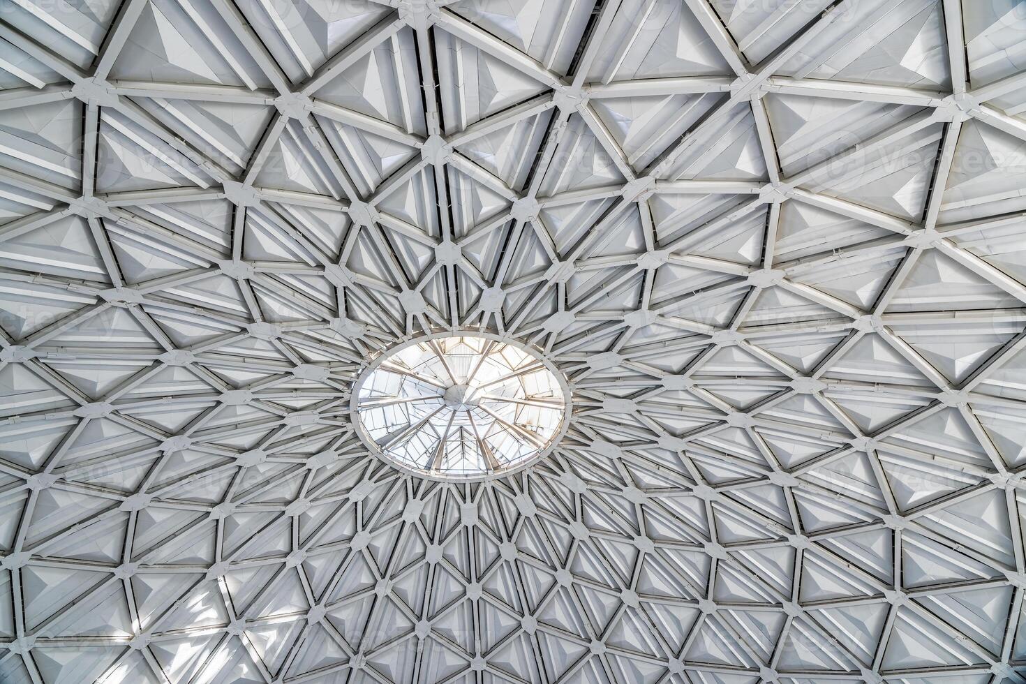 The steel inner part of the roof with the framework of the Chorsu Bazaar in Tashkent. Geometric architectural background. photo
