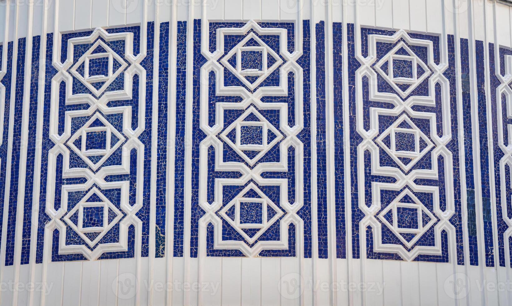 Geometric traditional Islamic ornament. Fragment of a ceramic mosaic. photo