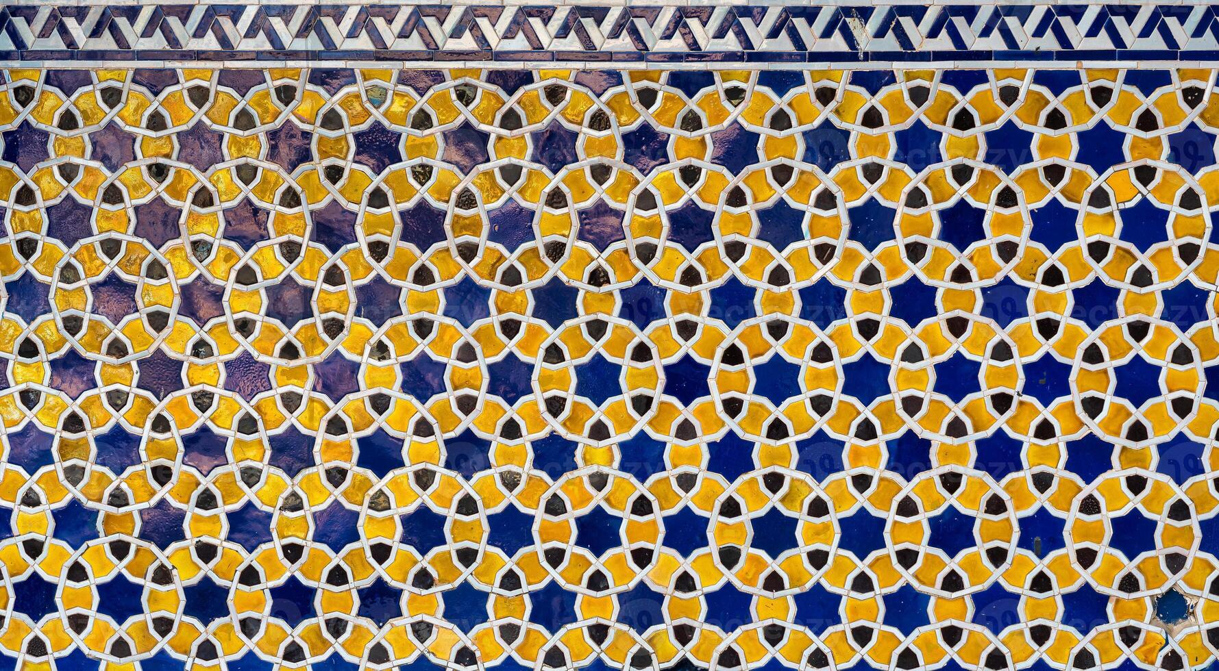 Geometric traditional Islamic ornament. Fragment of a ceramic mosaic. photo