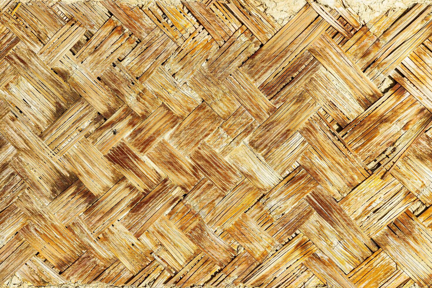 The texture of the frame of an oriental building made of woven bamboo. Abstract background. photo