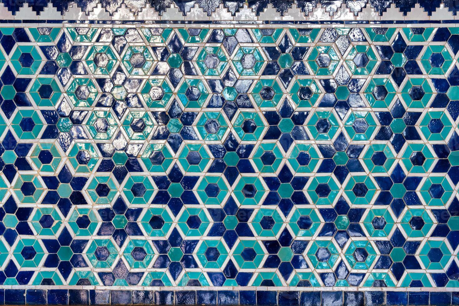 Geometric traditional Islamic ornament. Fragment of a ceramic mosaic. photo