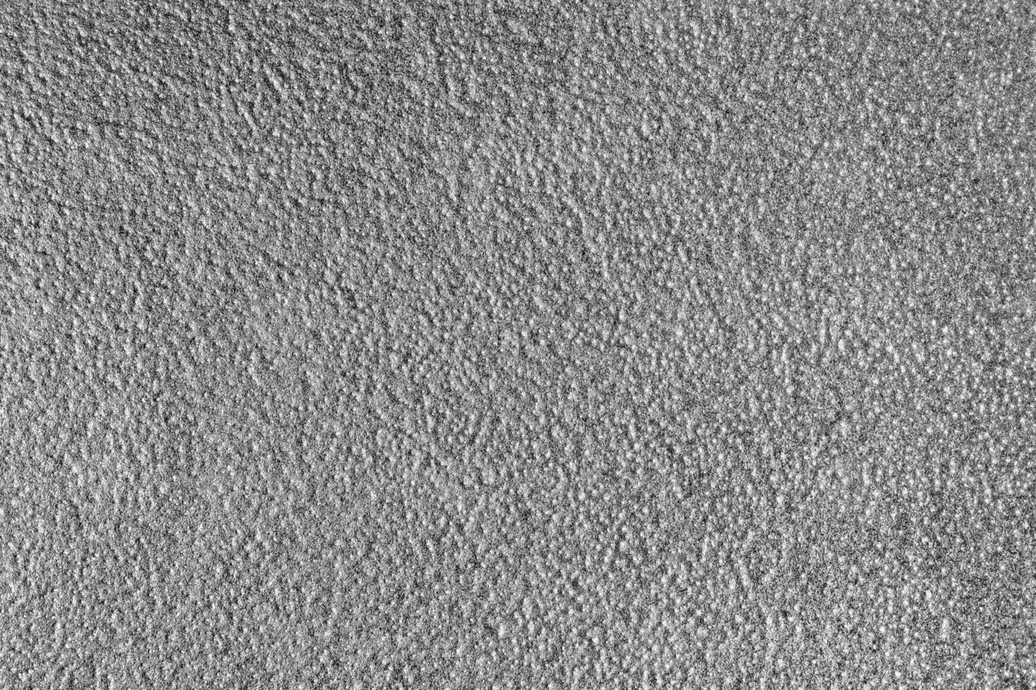 Monochrome texture of shiny grained metal. Abstract background. photo