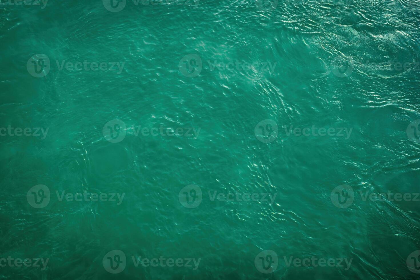 The texture of the waves of turquoise color of fast-flowing water in the river. photo