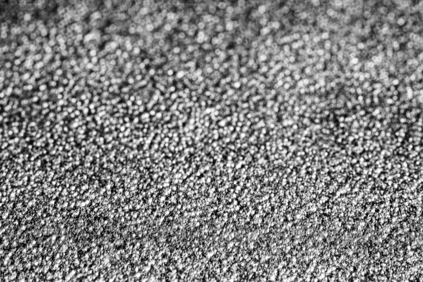 monocromo textura de brillante granulado metal. resumen antecedentes. foto