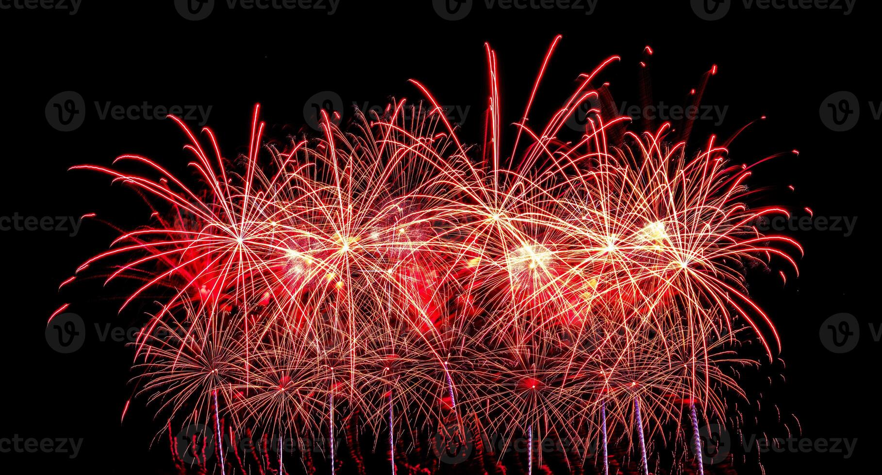 Colorful celebration fireworks isolated on a black sky background. photo