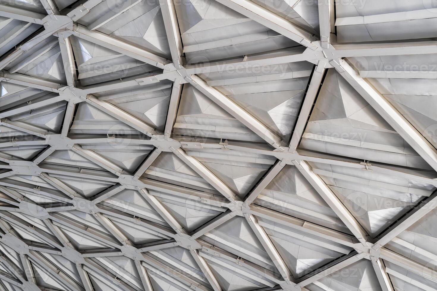 The steel inner part of the roof with the framework of the Chorsu Bazaar in Tashkent. Geometric architectural background. photo