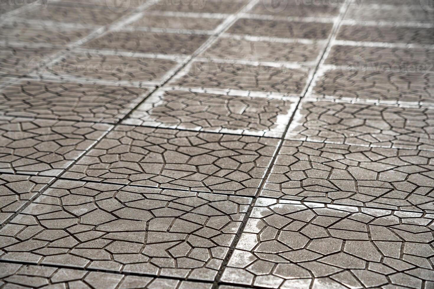 The texture of a tiled pavement with perspective. photo