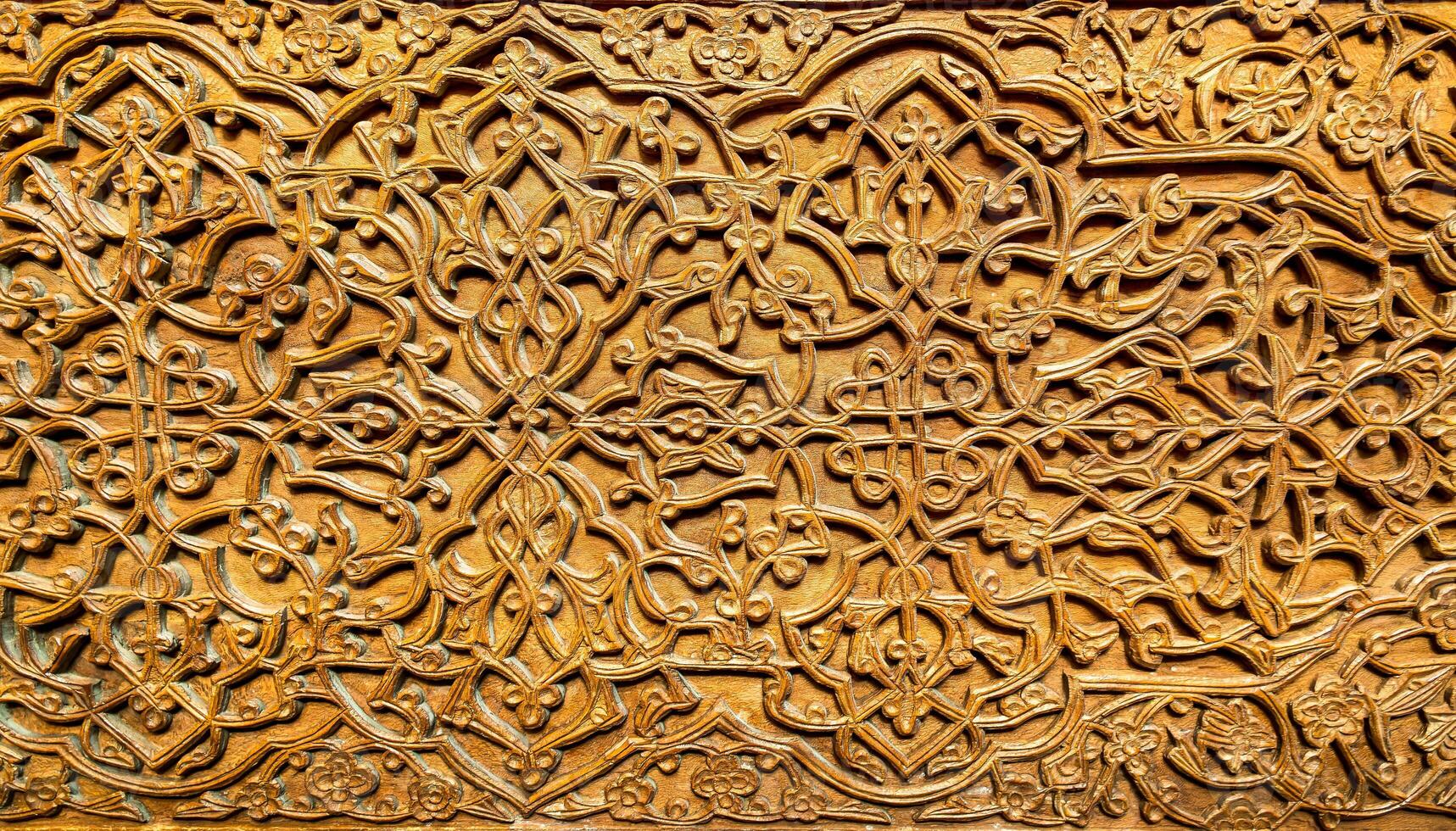 Fragment of an ancient carved wooden door. Ornate. photo