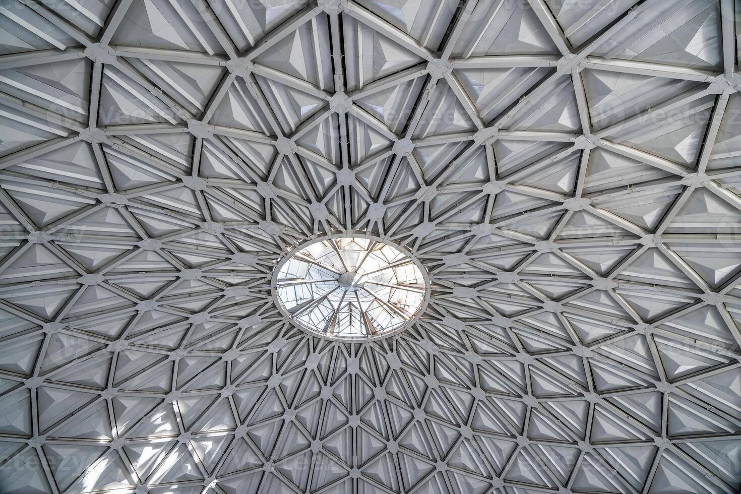 The steel inner part of the roof with the framework of the Chorsu Bazaar in Tashkent. Geometric architectural background. photo