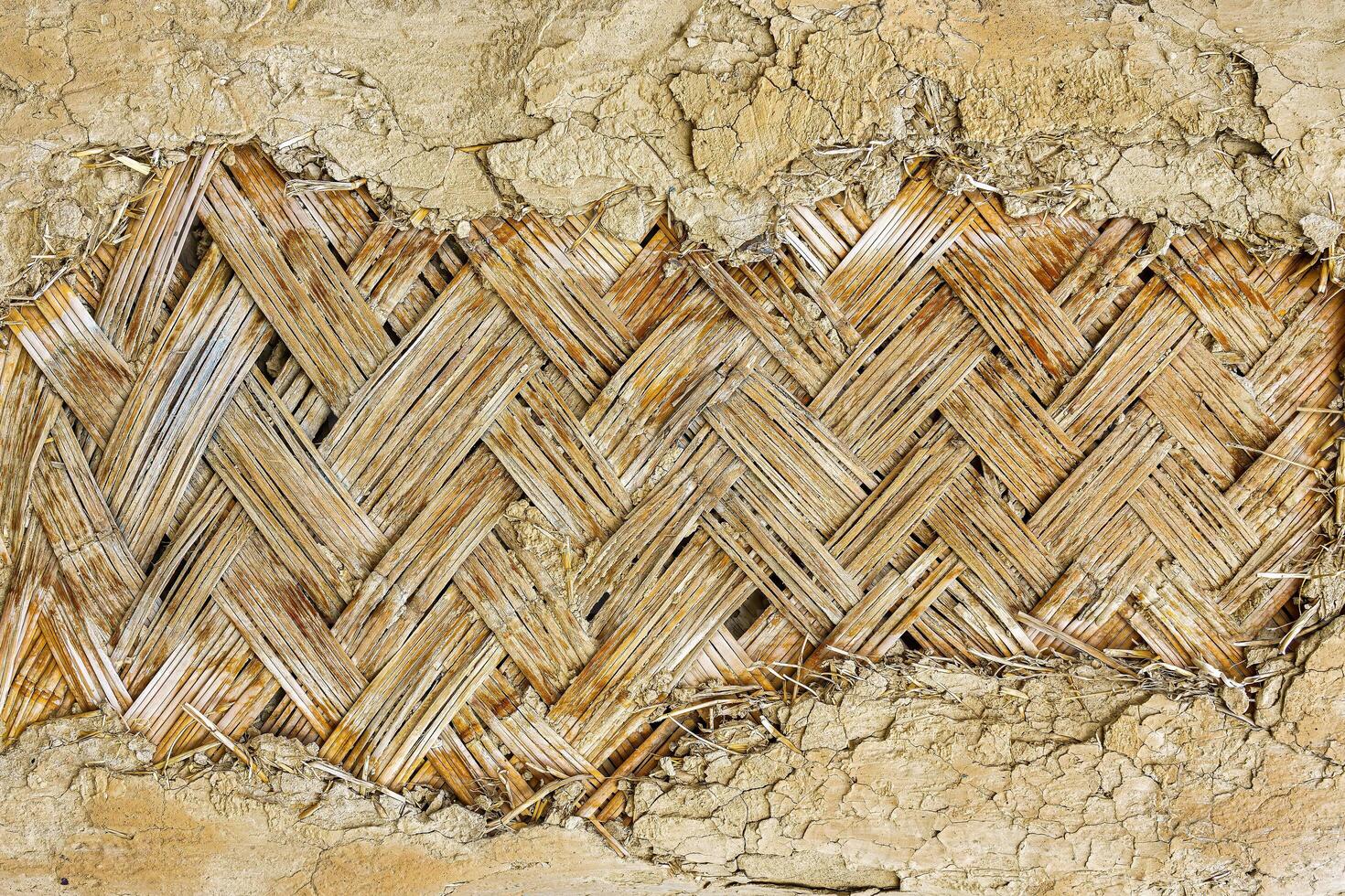 The texture of the frame of an oriental building made of woven bamboo. Abstract background. photo