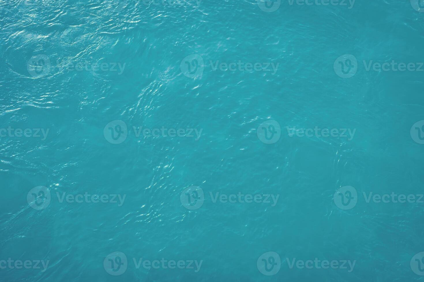 The texture of the waves of blue color of fast-flowing water in the river. photo