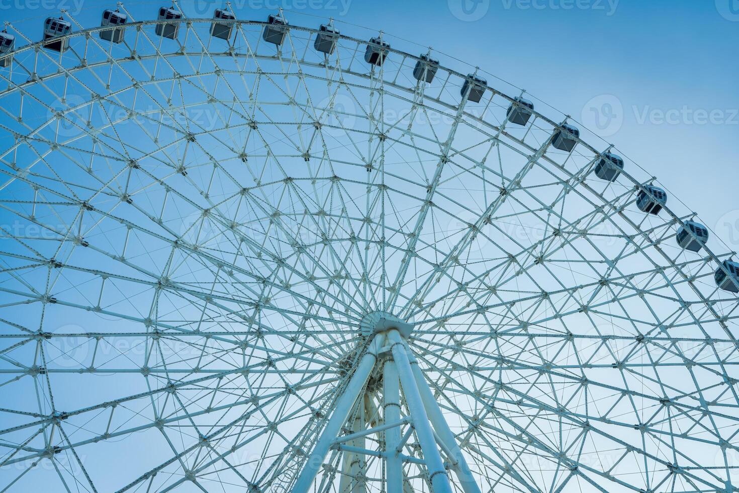 Ferris wheel at sunset or sunrise in an amusement park. photo