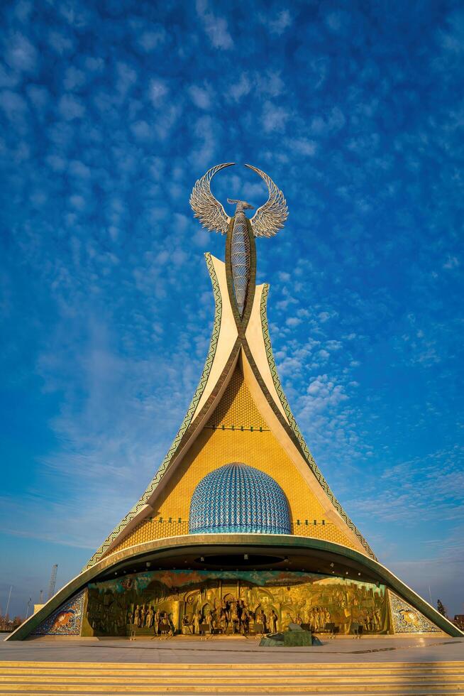 UZBEKISTAN, TASHKENT - JANUARY 4, 2023 Monument of Independence in the form of a stele with a Humo bird in the New Uzbekistan park. photo