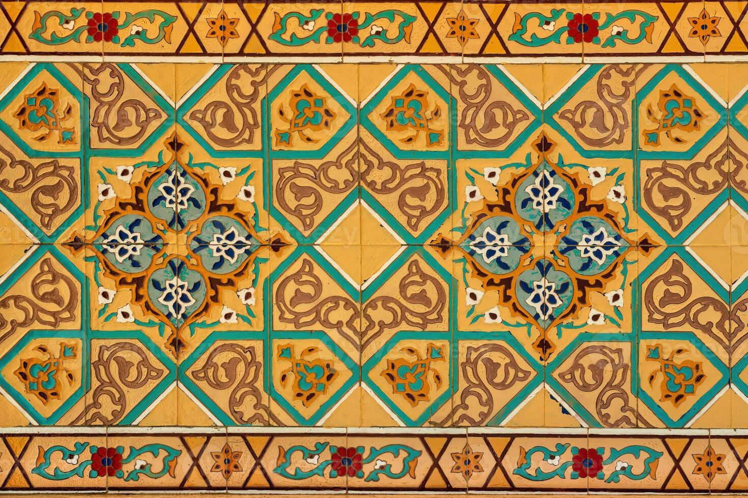 Geometric traditional Islamic ornament on a tile. Fragment of a ceramic mosaic. photo