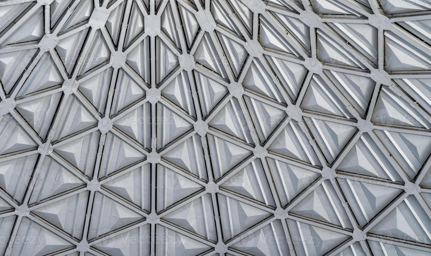 The steel inner part of the roof with the framework of the Chorsu Bazaar in Tashkent. Geometric architectural background. photo