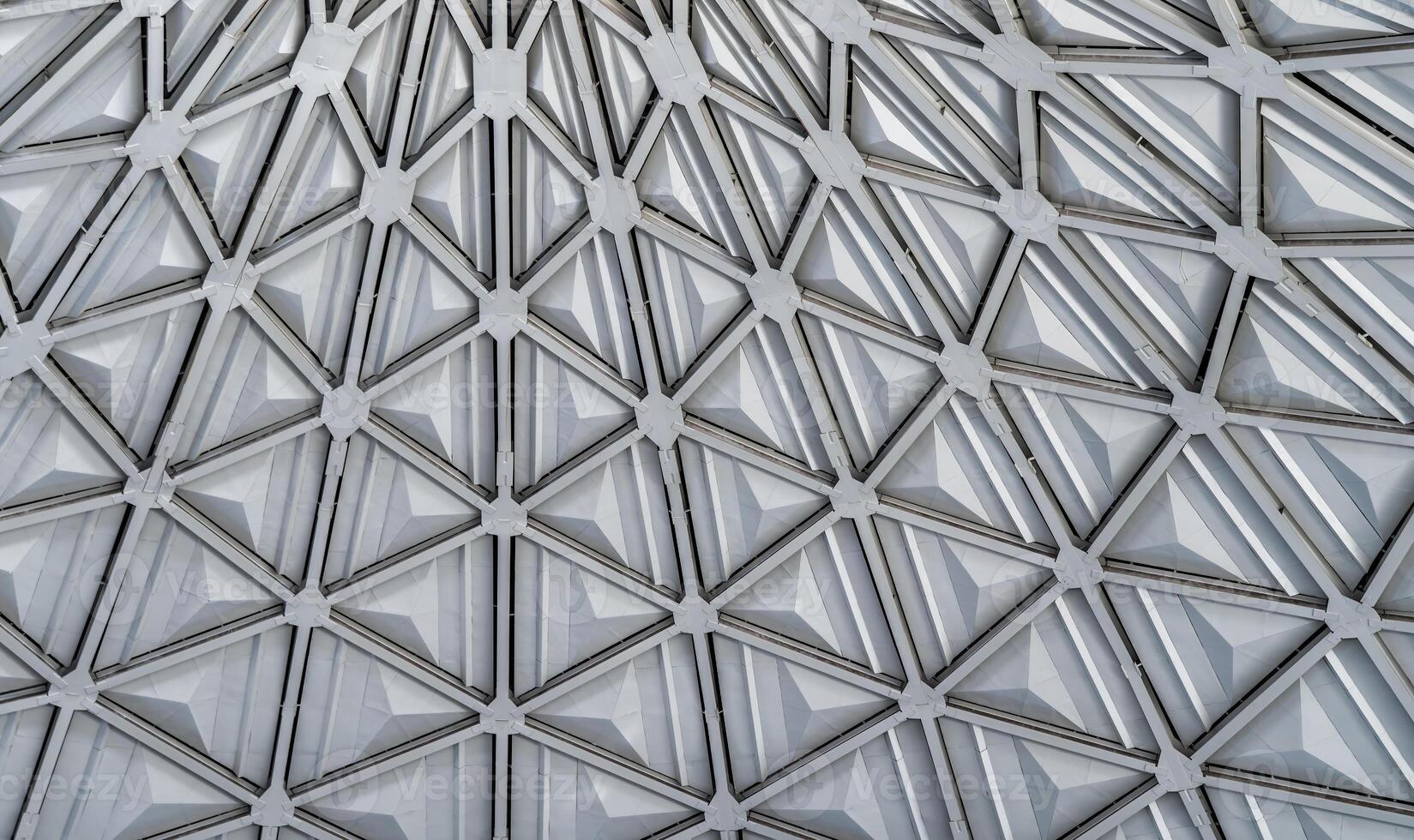 The steel inner part of the roof with the framework of the Chorsu Bazaar in Tashkent. Geometric architectural background. photo