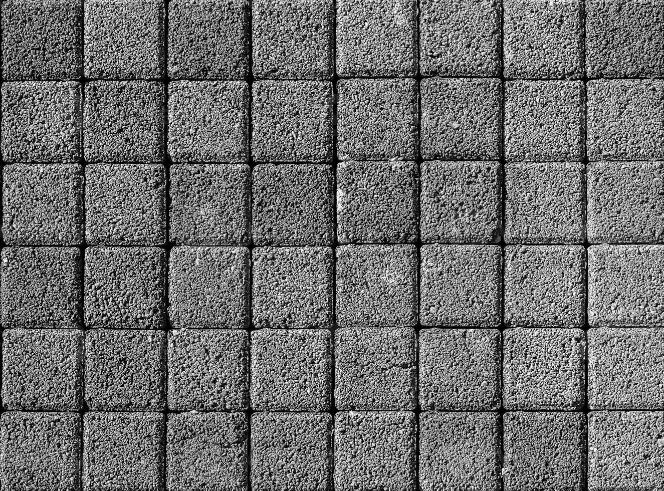 The texture of a stone monotonous pavement. Top view. Abstract background. photo