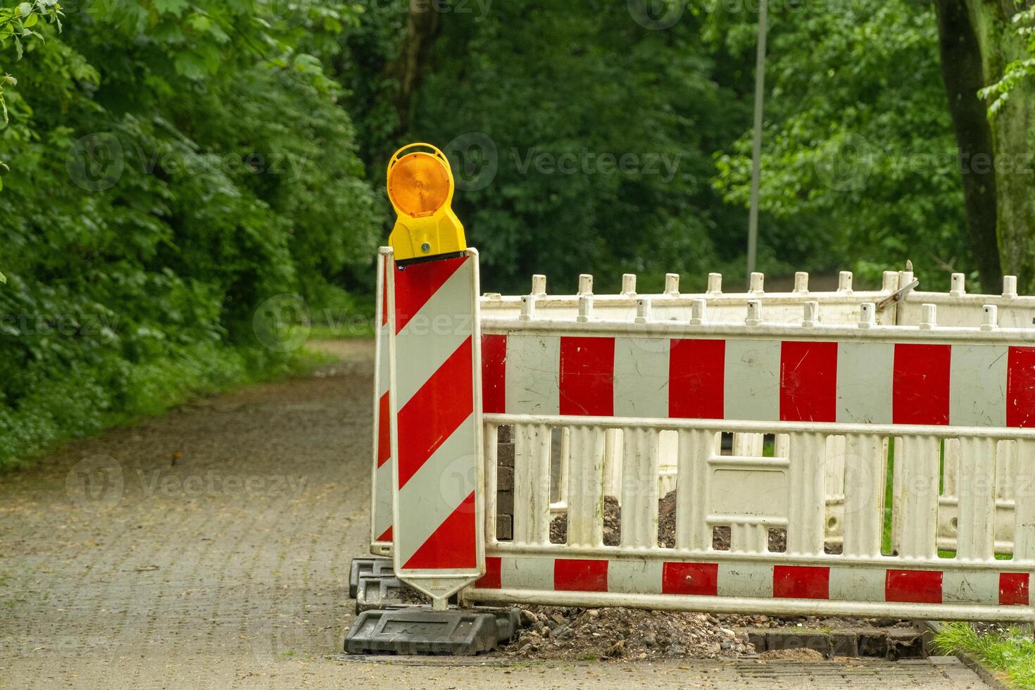 Construction site, white red barrier along the road photo