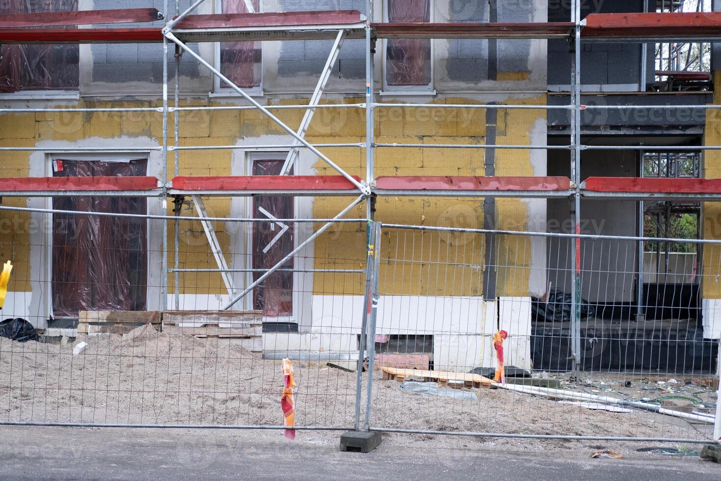 house construction site with scaffolding photo