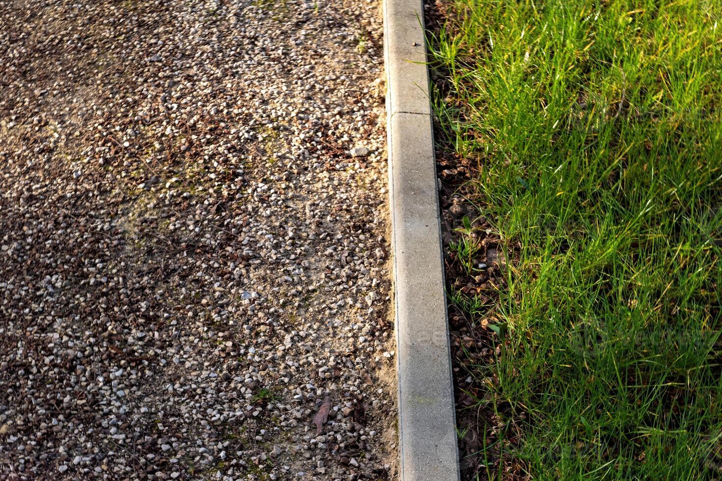 View from above Gravel path, curb, grass photo