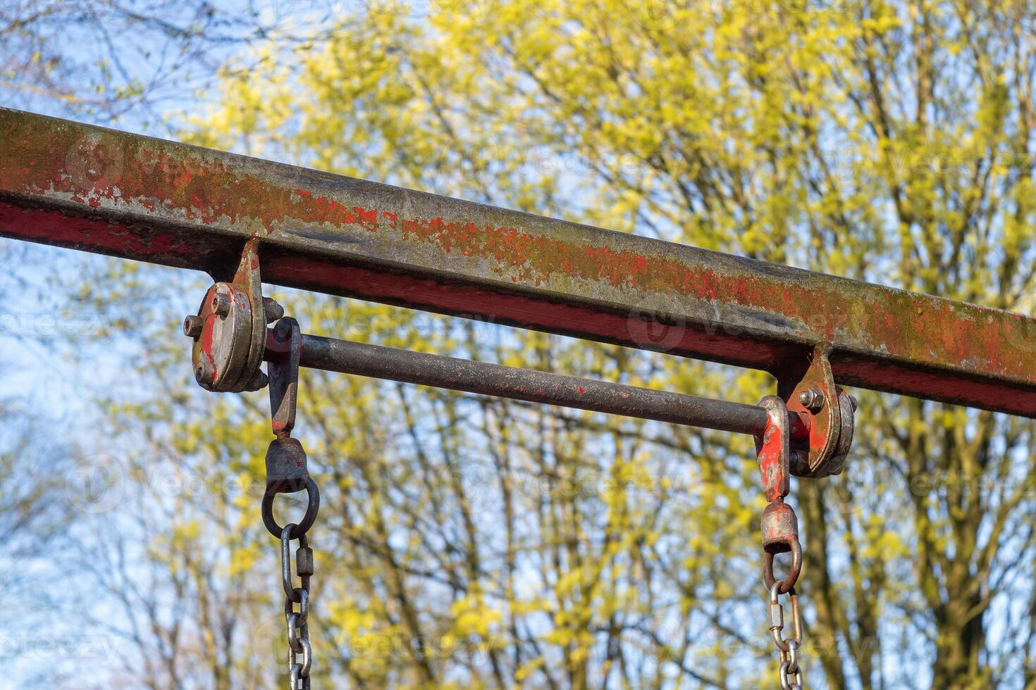 rusty bar of a swing scaffold photo